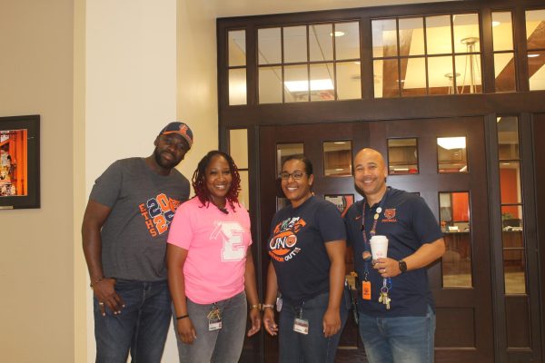 Staff members Corea, Tarra, Sirprize and Dr.Robinson looking out for students during passing period infront of the Main Office