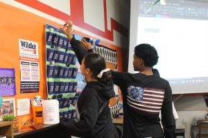 Math student Iur Yuma Aguilar and Mztli Medez puth their phones in the Cell Hotel.