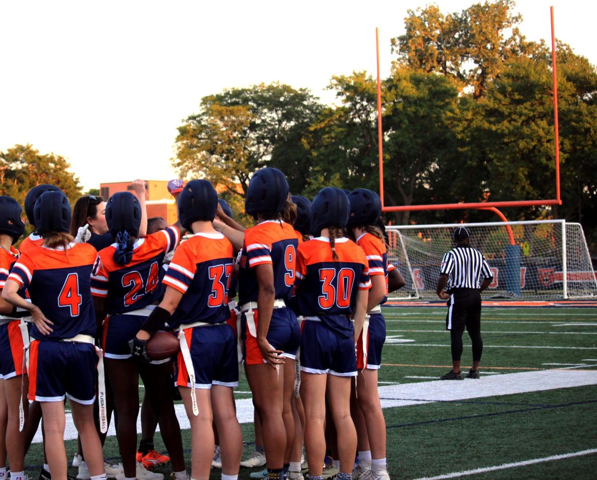 The team huddles before resuming game-play.