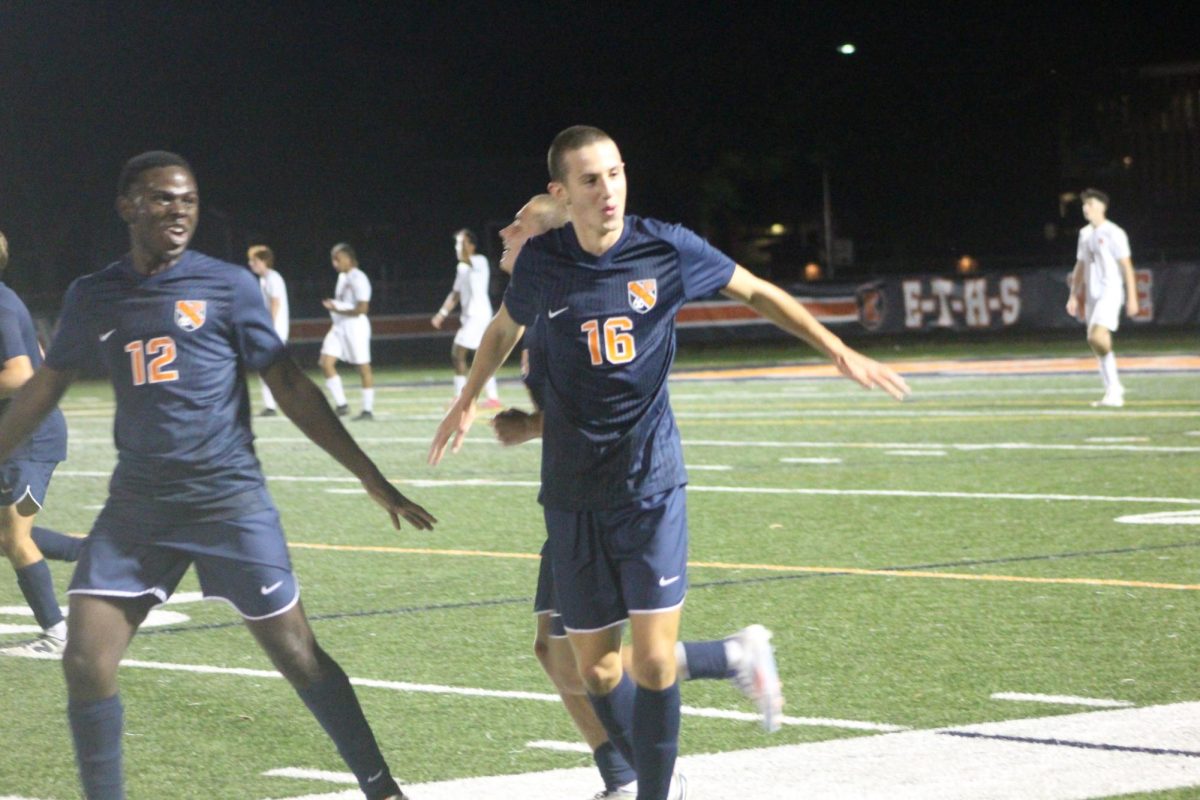 Junior Nico Dugo celebrates his first varsity goal.