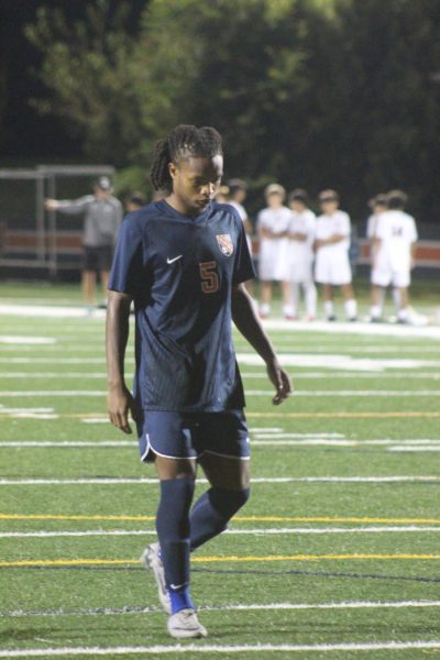 Senior Jospeh Sargent goes up to take penalty kick