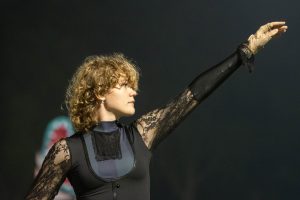 Junior Lilja Voneche performing in color guard dressed in the black lace Beetlejuice theme