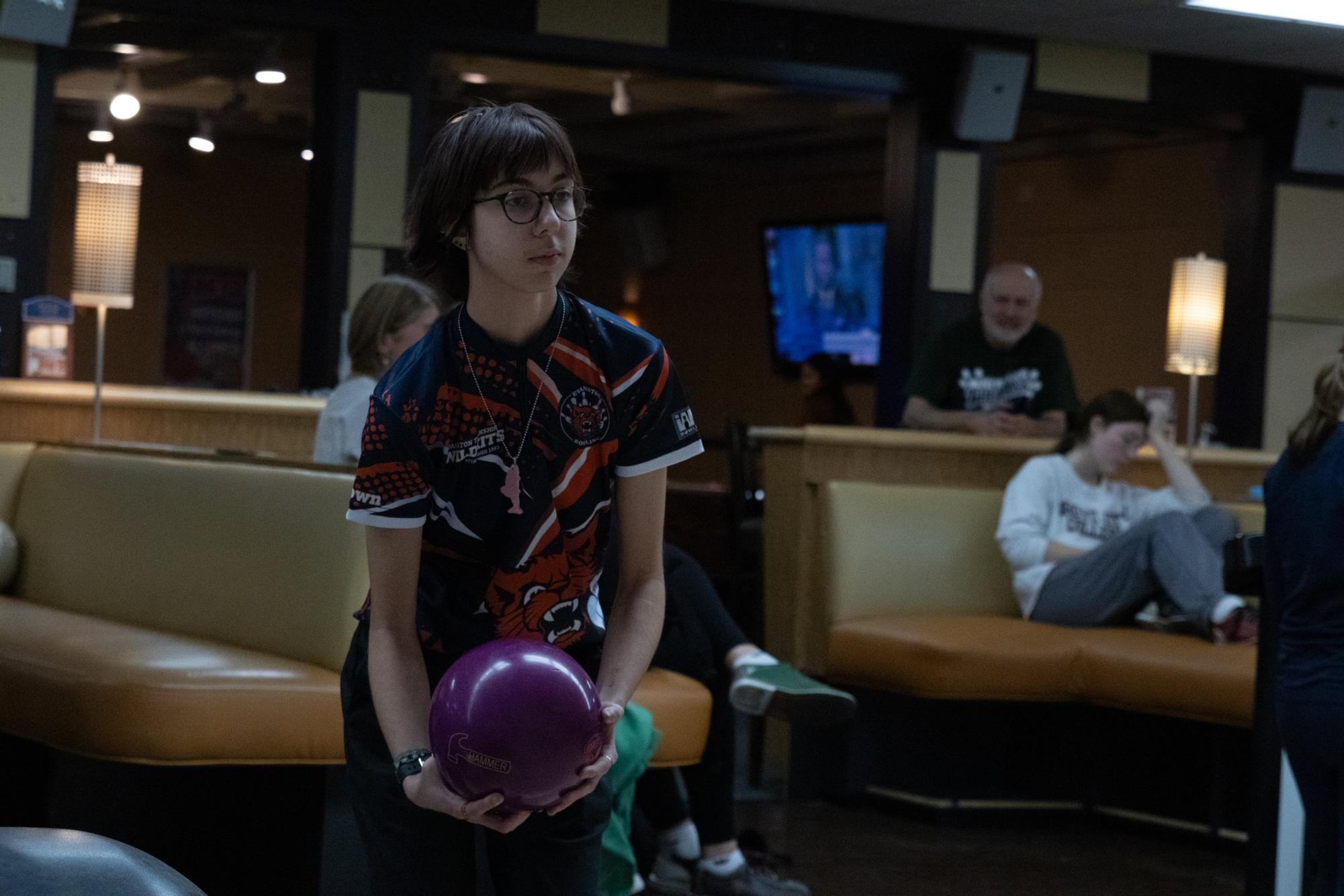 Senior EJ Bock looks down the lane for a strike.