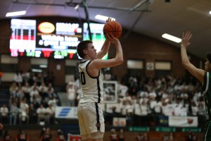 Boys basketball beat GBN in ugly home opener