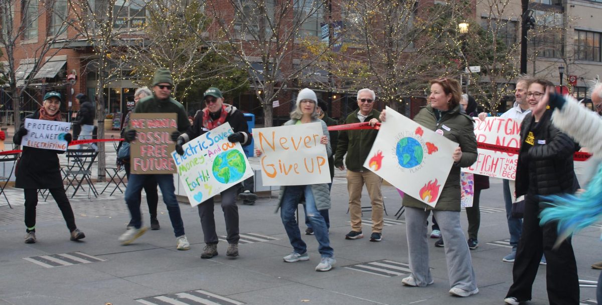 Protesters showing off homemade signs in Fountain Square  