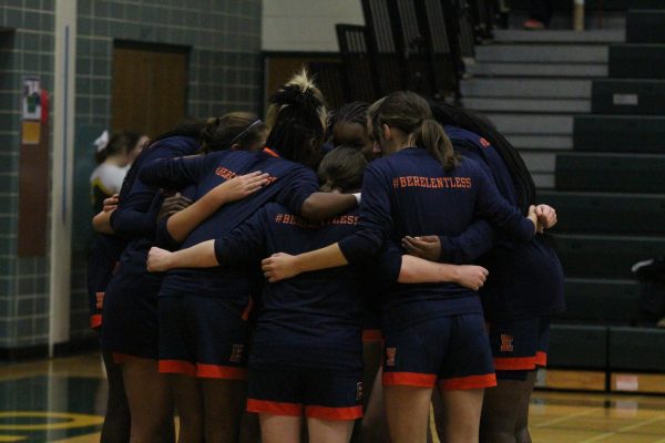 Evanston varsity girls' basketball in huddle before tipoff