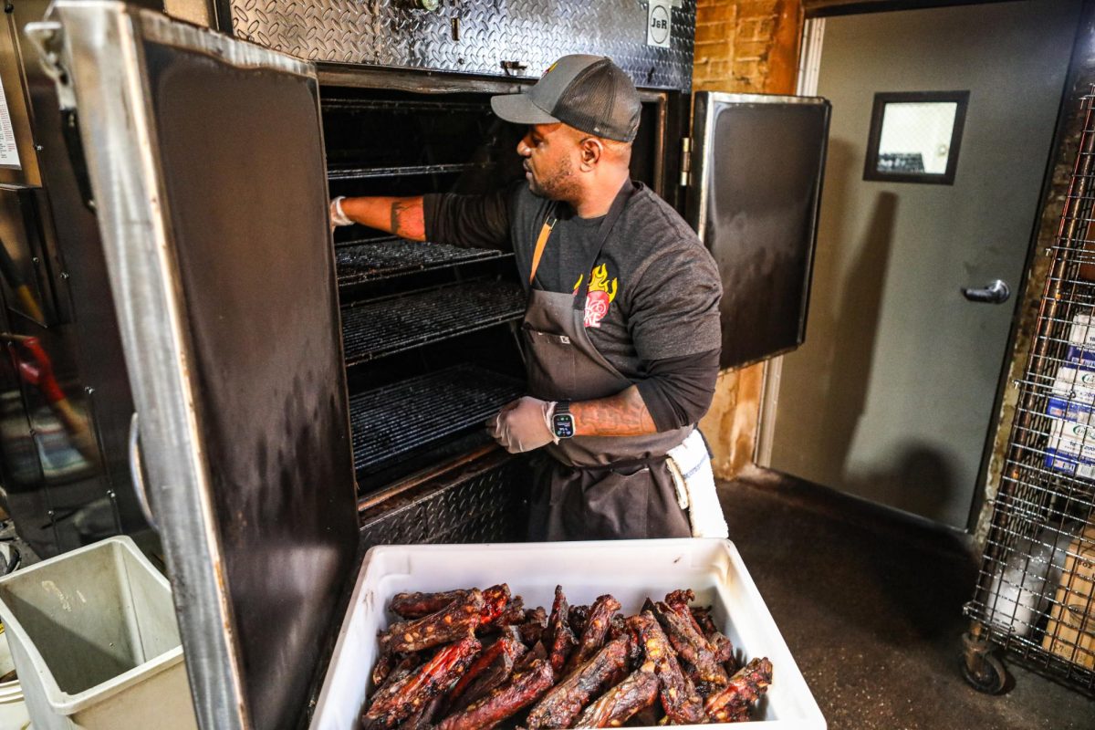 Head Chef D’Andre Carter smoking brisket.